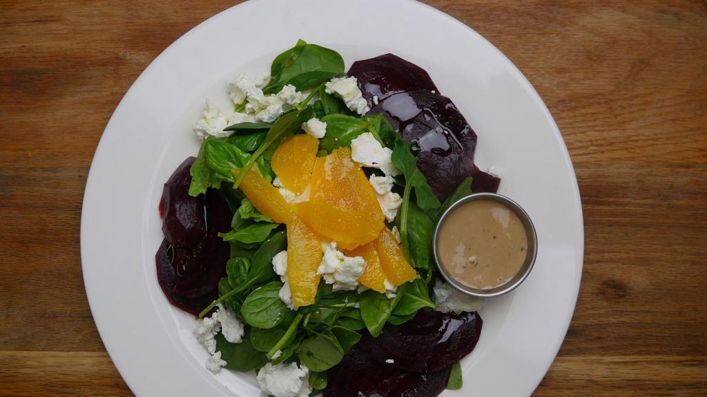 Roasted Beet Salad · Roasted beets, baby spinach, goat cheese, sliced oranges and honey balsamic.