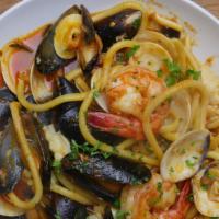 Seafood Pasta · Spaghetti, mussels, clams, calamari, and shrimp in a white wine tomato sauce.