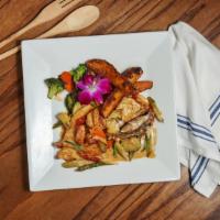 Pollo Daniel · Pan-seared chicken breast topped with portobello mushroom, jumbo shrimp, sundried tomatoes a...