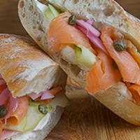 Smoked Salmon Sandwich · Smoked Salmon layered with Fresh Cucumbers, Pickled Onions and Capers on a Bed of Cream Chee...
