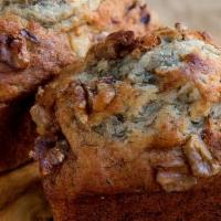 Banana Walnut Bread · A moist personal loaf of freshly cut bananas and rich walnuts.