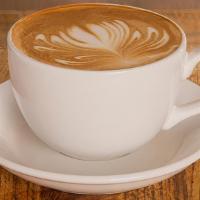Cappuccino · A creamy blend of artisan espresso and steamed milk layered with a generous foam cover.