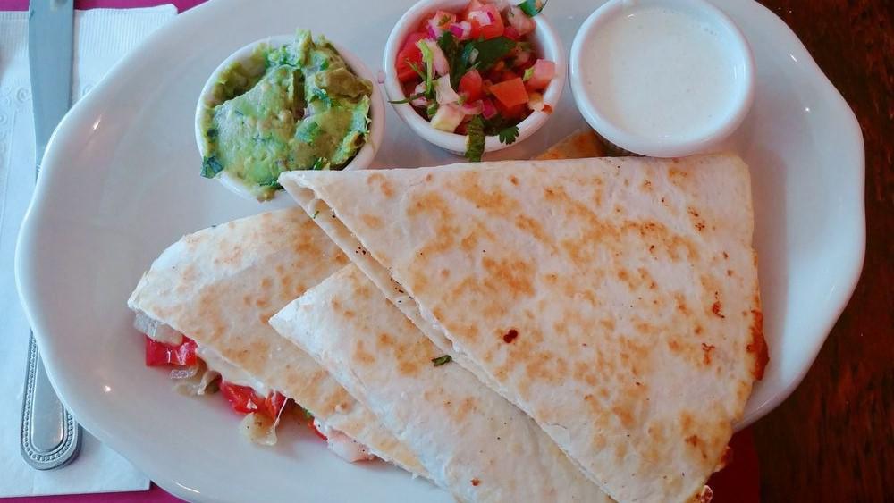 Shrimp Quesadilla · Marinated shrimps, onions, peppers, Oaxacan and cheddar cheese, served with guacamole, sour cream, pico de gallo.