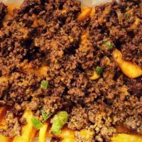 Chopped Cheese Over Fries  · seasoned ground beef (grilled peppers and onions mixed with American cheese) over fries, cho...