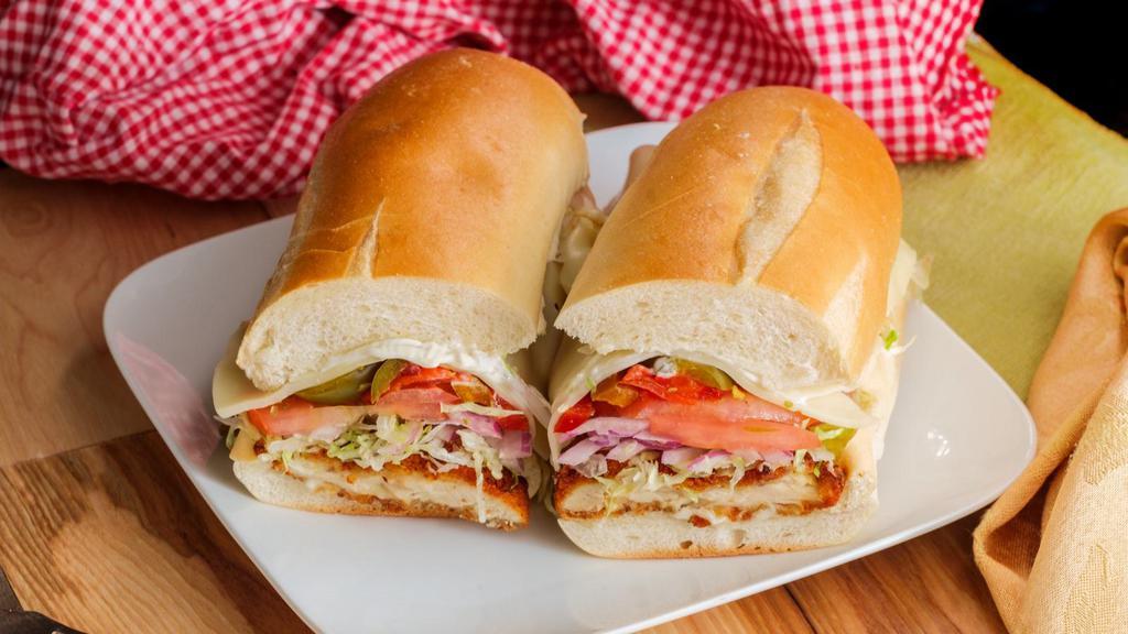 The Chicken Cutlet Sub · Golden fried, breaded chicken cutlet topped with your choice of cheese, fresh tomato, lettuce oil and vinegar, oregano, salt, pepper and mayo.