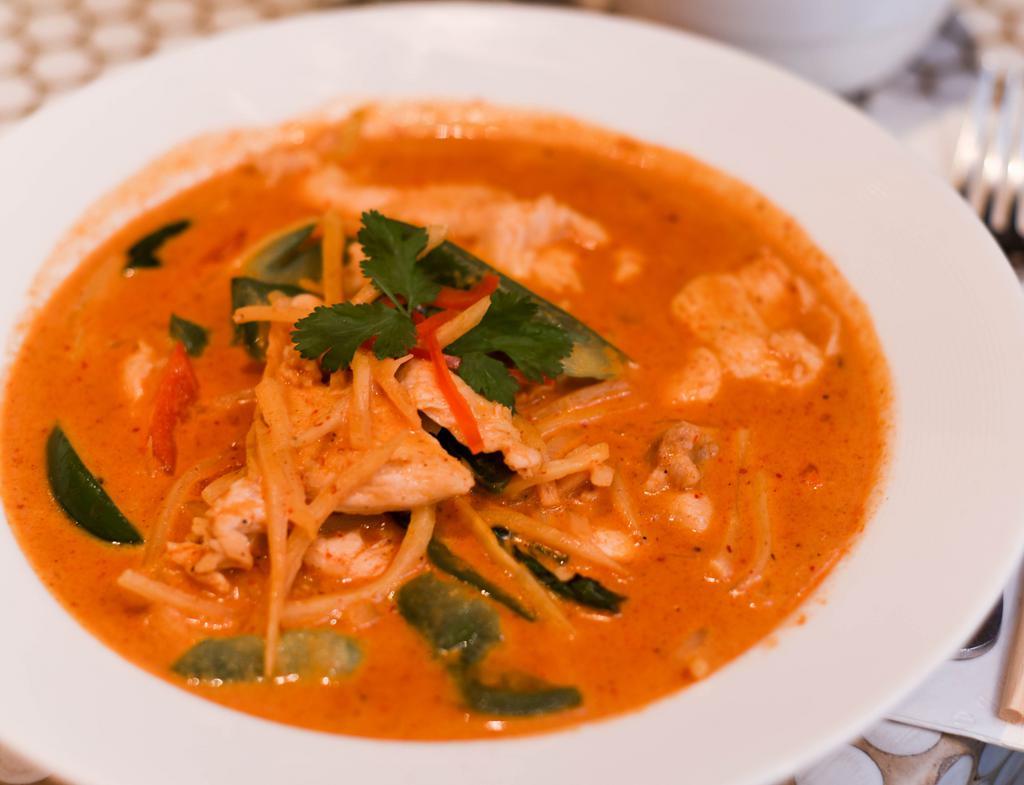 Red Curry · Spicy red chili paste with bamboo shoot, bell pepper, basil in coconut milk.
