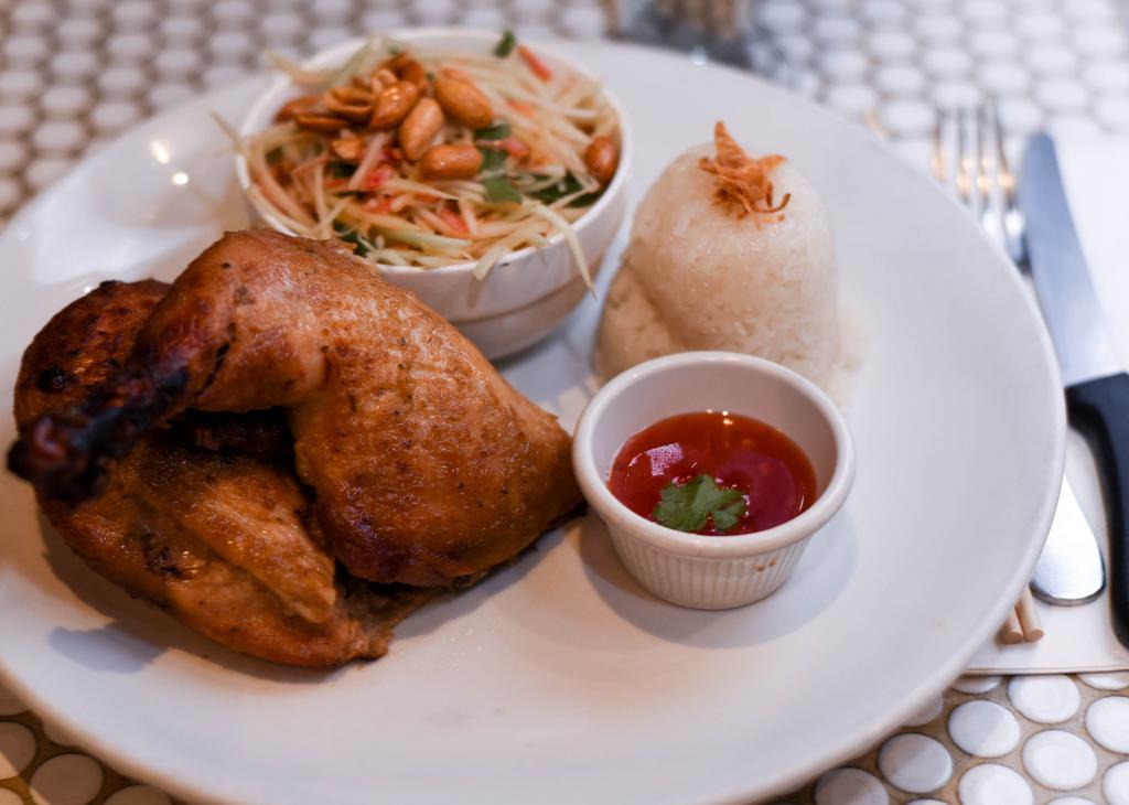 Thai Bbq Chicken · Grilled half chicken served with papaya salad and sticky rice.