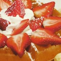 Super Waffle · With ice cream, fresh strawberries, whipped cream & sprinkles, topped with chocolate syrup.