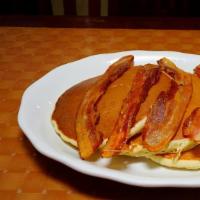 Pancakes · Fluffy Golden Brown Pancakes served with butter and syrup