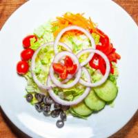 Tavern Salad · Iceberg romaine mix, tomato, black olives, roasted peppers, red onions, carrots.