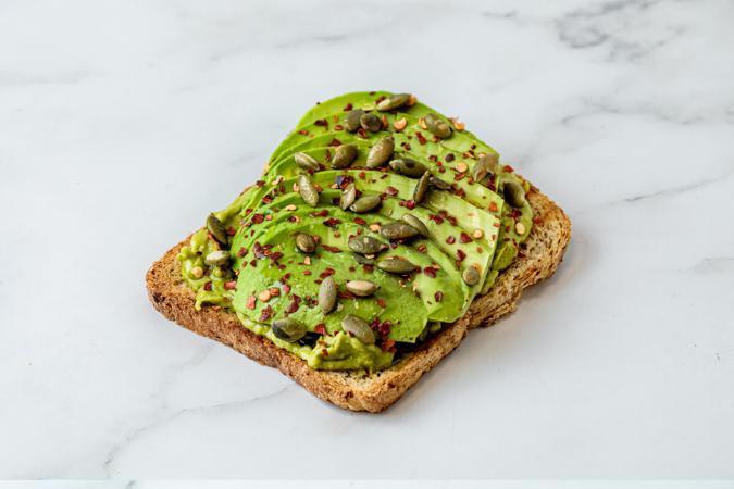 Avocado Toast · *Hamotzi* Toasted multigrain bread, freshly sliced avocado on a layer of smashed avocado, topped with chili flakes, pumpkin seeds, olive oil, salt & pepper.