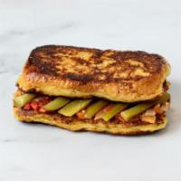 French Toast Sandwich · french toast made with our house baked breakfast bread, shakshuka blend, israeli pickles.