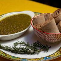 Misir Alicha · Green lentils slowly cooked in a flavorful mild sauce with a blend of spices.