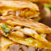 Grilled Chicken Quesadilla. · Grilled chicken with Tito’s cheeses melted inside 12-inch flour tortillas with sour cream an...