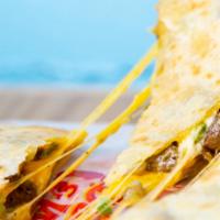 Grilled Steak Quesadilla. · Grilled steak, Tito’s cheeses melted inside 12-inch flour tortillas with sour cream and our ...