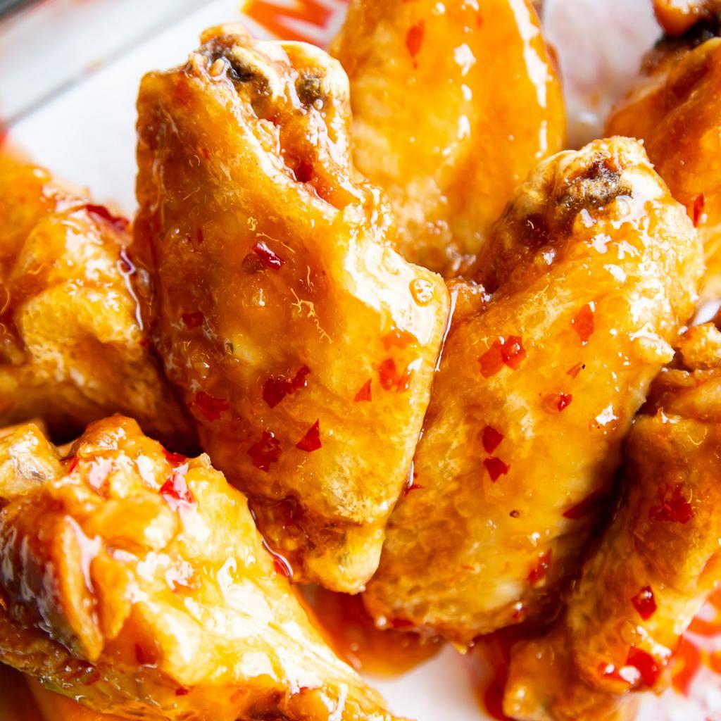 6 Wings. · 6 wings cooked to order. Served with celery and carrots with your choice of toss sauce and dip sauce.