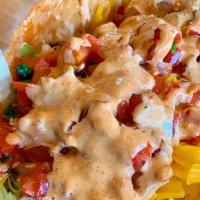 The Fat Amy Taco. · A jumbo, 12-inch flour tortilla crispy fried and stuffed with plump, juicy fried organic chi...