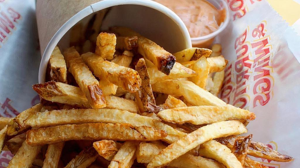 Hand-Cut Fries. · Idaho potato fries served with housemade spicy chipotle sauce