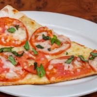 Pizza Margherita · Fresh tomatoes, garlic, basil and mozzarella (no sauce).
