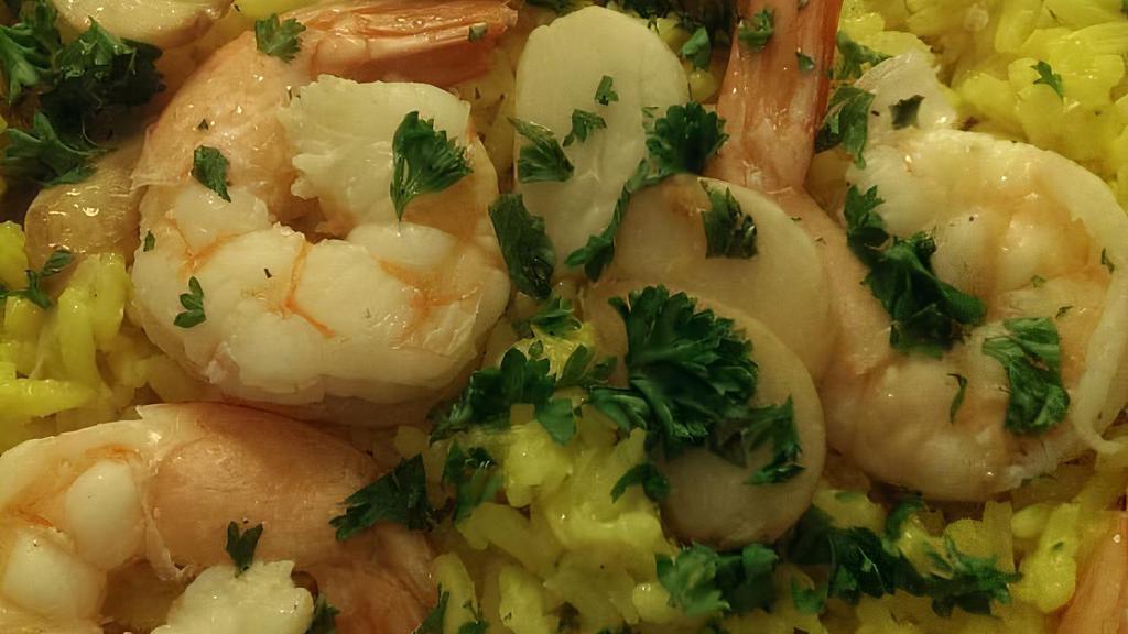 Shrimp Scampi · Garlic sauce and rice.