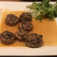Stuffed Mushrooms · Stuffed with our homemade vegetable stuffing.