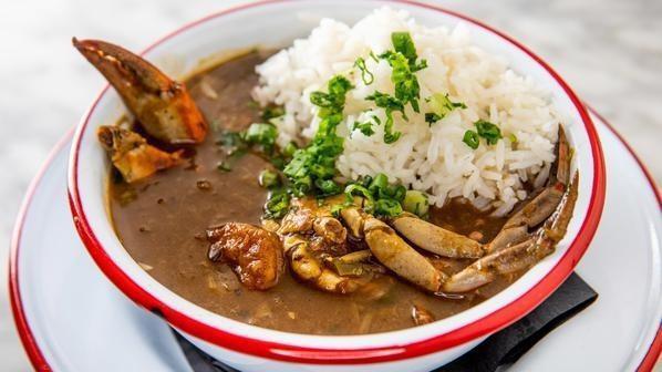 Seafood & Okra Gumbo · Traditional New Orleans gumbo with blue crab,shrimp, oysters, okra and a dark brown roux, steamed rice