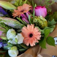 Seasonal Wrap Bouquet · A beautiful array of seasonal florals, selected and arranged in a wrap bouquet, that lets yo...