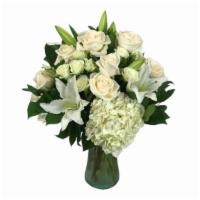 Lily'S Light · With crisp whites, this arrangement is guaranteed to light up anyone's day! With florals inc...