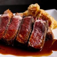 Angus Rib-Eye Steak · Dry Aged 12oz Steak w/ Bone Marrow Sake Soy Sauce, Option of Rice is Ordered Separately