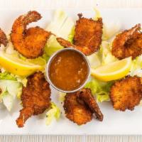 Coconut Shrimp · Made right here with a side of duck sauce.