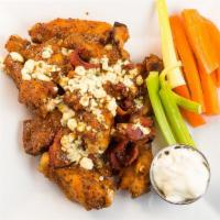Ralph'S Famous · Marinated wings topped with bleu cheese crumbles and crispy bacon.