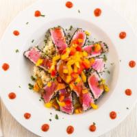 Ying/Yang Tuna · Sesame crusted yellowfin tuna over wasabi mashed potatoes topped with seaweed salad, sweet p...