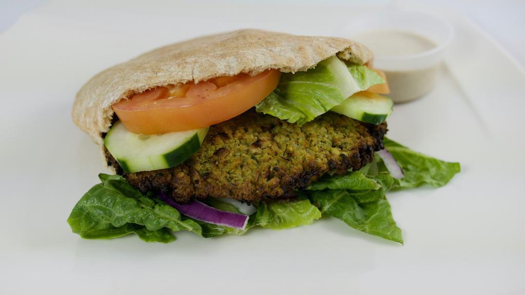 Falafel Sandwich · Baked falafel, hummus, lettuce, tomato, cucumber and onions in a wheat pita.