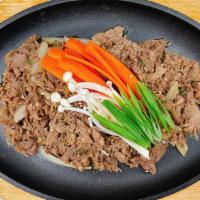 Beef Bulgogi - 소 불고기 · Sliced chuck eye marinated in Bulgogi sauce. Stir-fried with vegetables.
