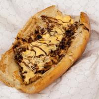 Chicken Cheesesteak · Grill-shredded chicken breast, served with pepperjack cheese and topped with cheese sauce on...