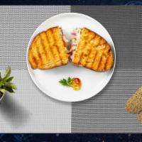 Tuna Melts Panini · Fresh tuna salad, cheddar cheese, lettuce, and tomato on toasted bread.