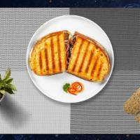 Russian Rush Panini · Roast beef, Muenster cheese, caramelized onion, lettuce, plum tomato, and Russian dressing o...
