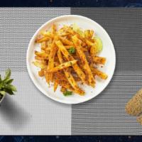 Spiced Fries · Idaho potato fries cooked until golden brown and garnished with seasoning.