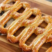 Soft Pretzel · Hand-twisted. Fresh-baked. Always delicious.  Available in quantities of (5,10,20,50,100)