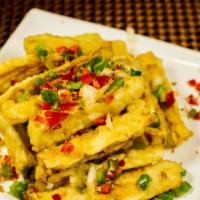 King Oyster Mushrooms · Mild. Soy Free Option. Battered king oyster mushroom fries tossed with chopped fresh bell pe...