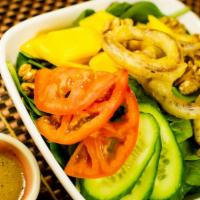 Mango Spinach Salad · Soy Free Option and Gluten free option. Chopped mango & spinach accented with battered onion...