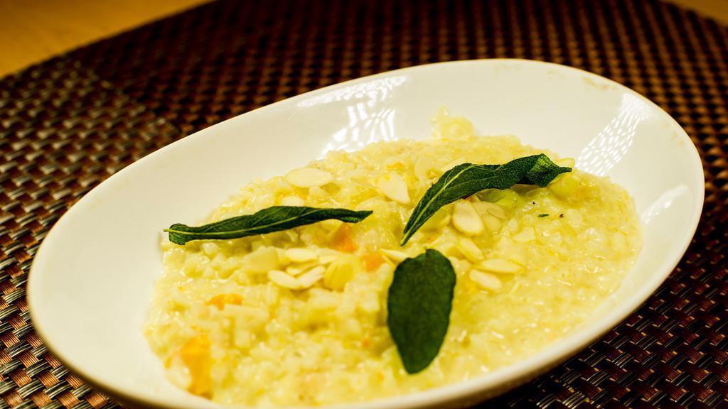 Butternut Risotto · Soy free option & Gluten free option. A butternut squash risotto garnished with almond flakes.