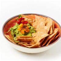 Chips And Guacamole · cilantro lime puree, serrano chile, heirloom corn chips (contains: garlic, cilantro, chili)