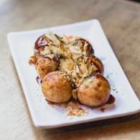 Takoyaki From Otafuku · Grilled octopus balls slathered with our special sauce, mayo, seaweed flakes, and dried boni...