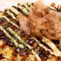 Fried Egg & Corn Okonomiyaki · Savory FRIED EGG & CORN pancake with crunchy cabbage & a variety of fresh ingredients, speci...