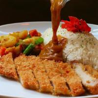 Berkshire Pork Katsu Curry · Deep-fried pork cutlet, tender inside and crispy outside served w/ curry, rice, and assorted...