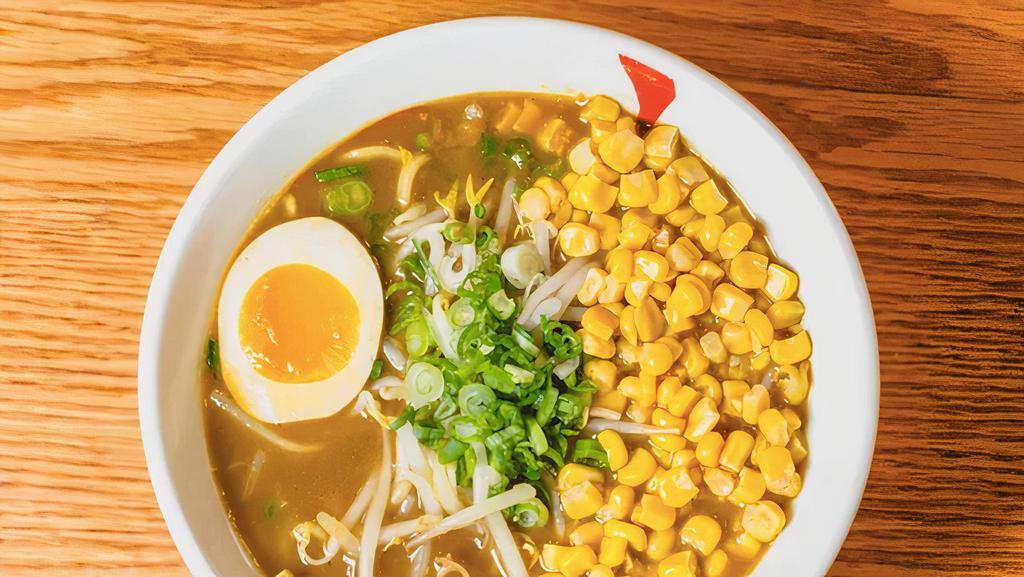 Curry Ramen · Vegetarian ramen in house-made curry soup.  Served with wavy noodles, corn, bean sprouts, scallions & egg. Croquette & cheese recommended!