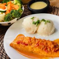 Salmon Napoles · Salmon served in a creamy napoles sauce paired with mashed potatoes and a fresh side of vege...