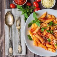 Tomato Basil Penne Pasta · Fresh tomato based sauce mixed with penne pasta served with parmesan cheese.