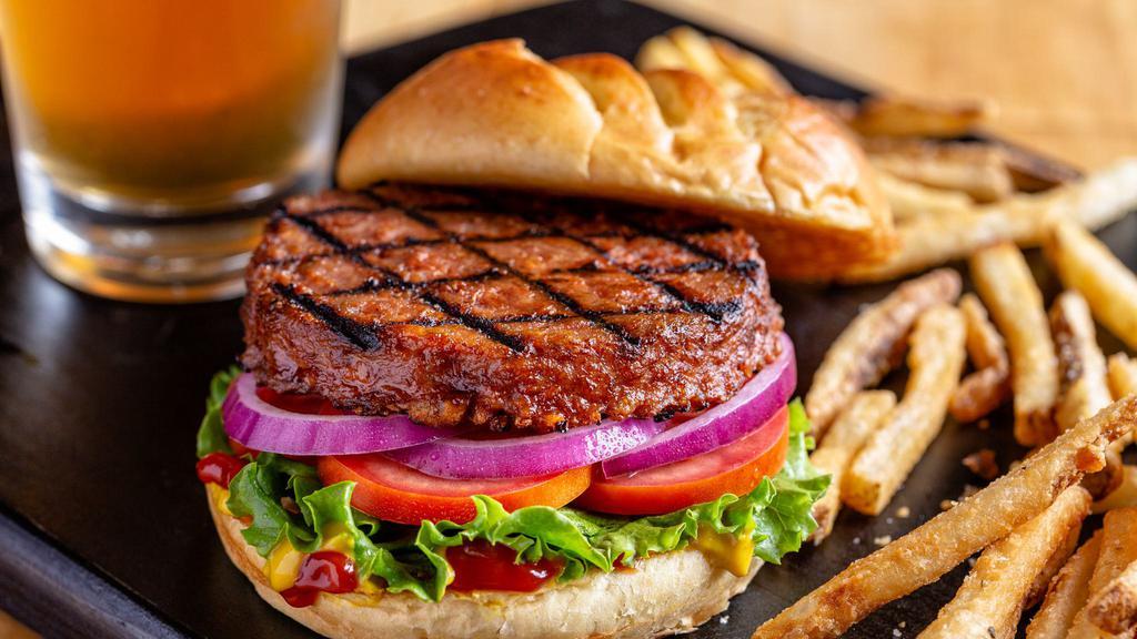Classic Beyond Burger · A plant-based burger from Beyond Meat® grilled and served on a toasted bun with ketchup, mustard, lettuce, tomato, and red onion. Comes with one side.
